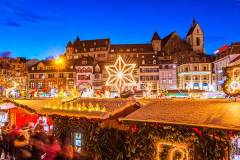 View over the christmas market at the Barf?ssplatz in Basel, Switzerland, at dusk.