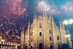 Duomo cathedral with fireworks - celebration of New Year in Milan, Italy