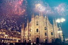 Duomo cathedral with fireworks - celebration of New Year in Milan, Italy